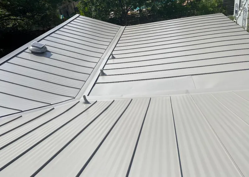 Solar attic fan installed on a metal roof for Roof Ventilation in Tarboro